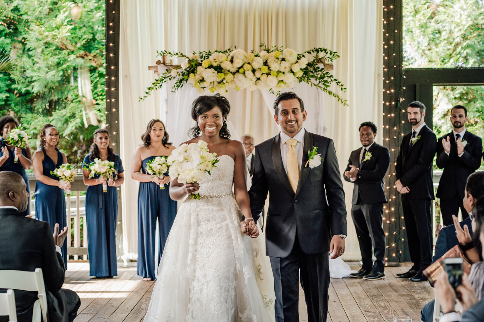 Carissa and Vikas smiling together after their ceremony